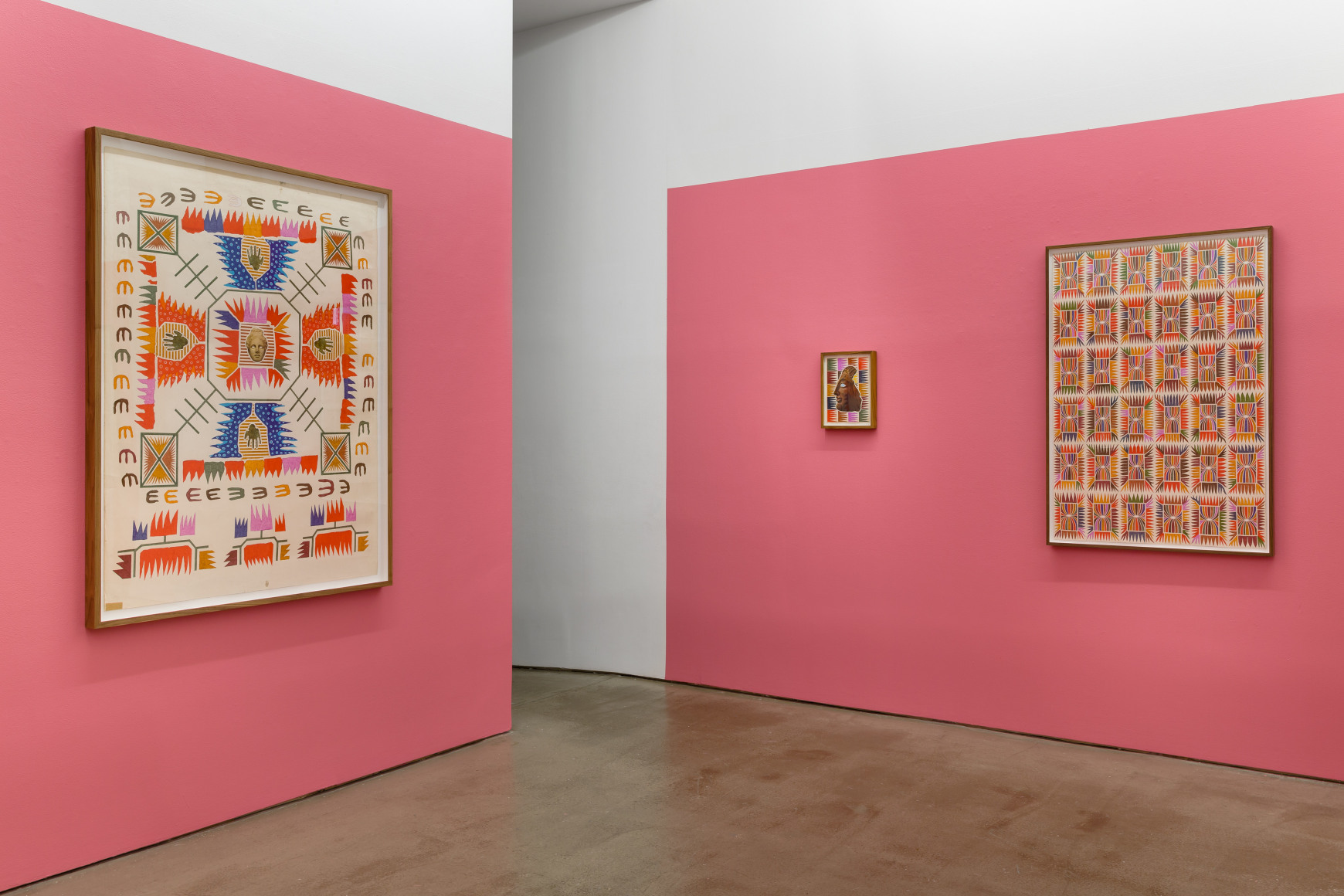 An installation view of Matthew Craven's solo exhibition, in which large and small framed collage pieces are hung on the gallery walls. There is a doorway