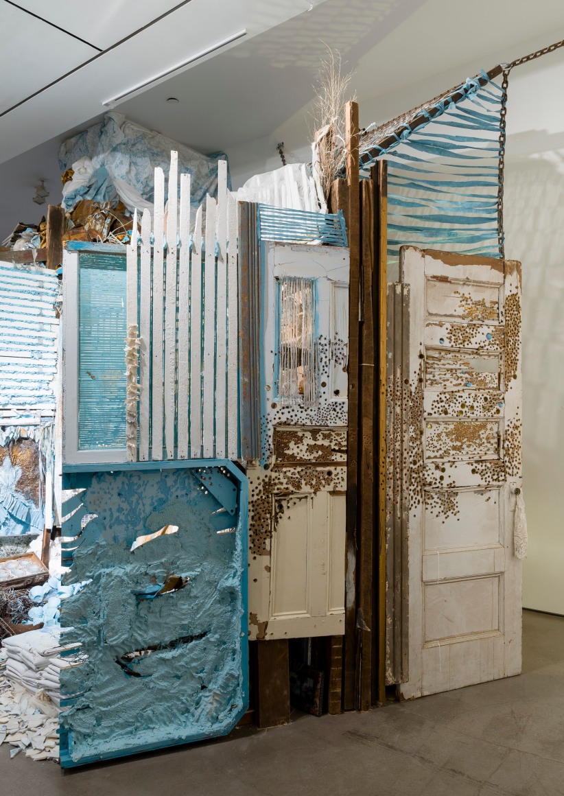 Large installation by Julie Schenkelberg including reclaimed wood and household materials