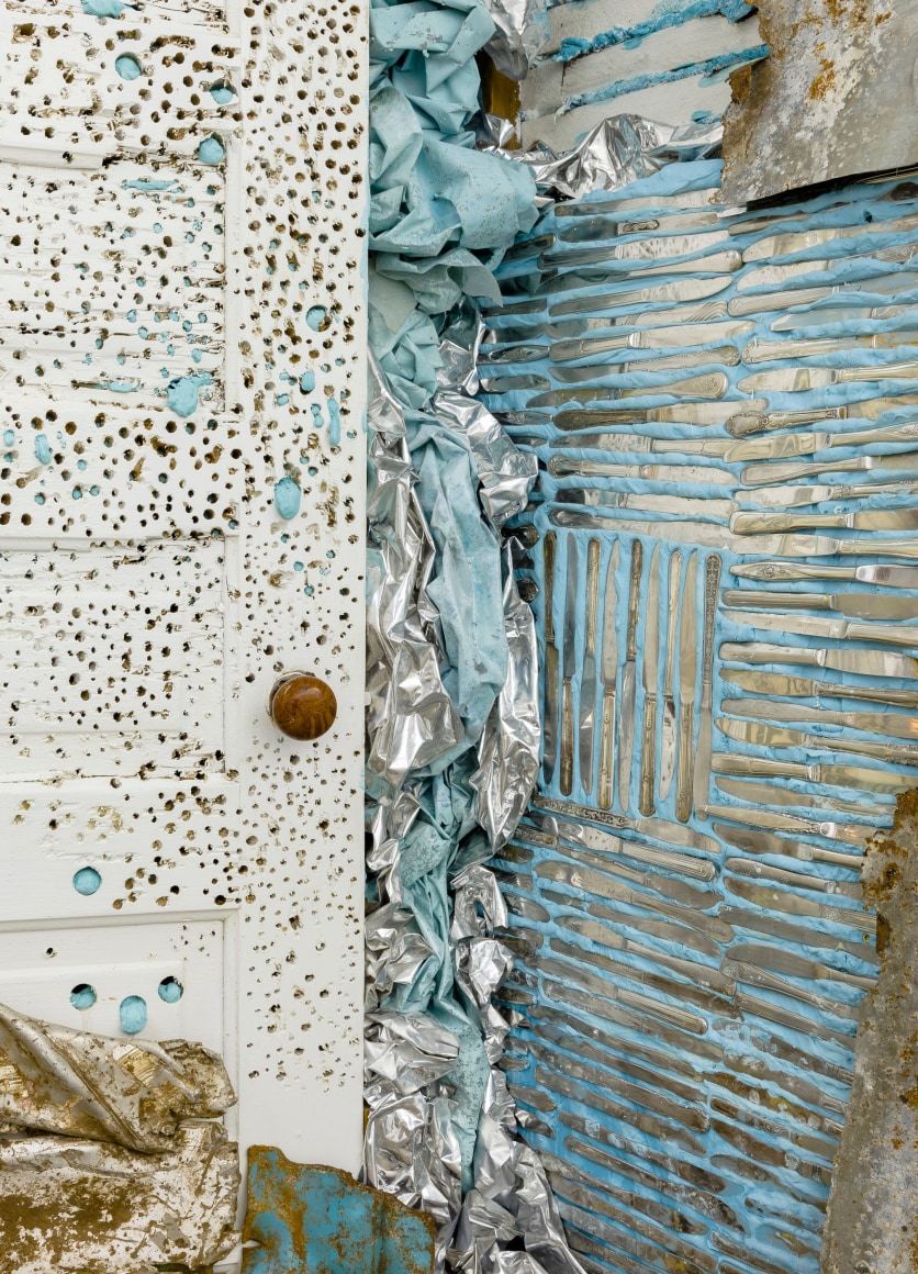 Large installation by Julie Schenkelberg including reclaimed wood and household materials