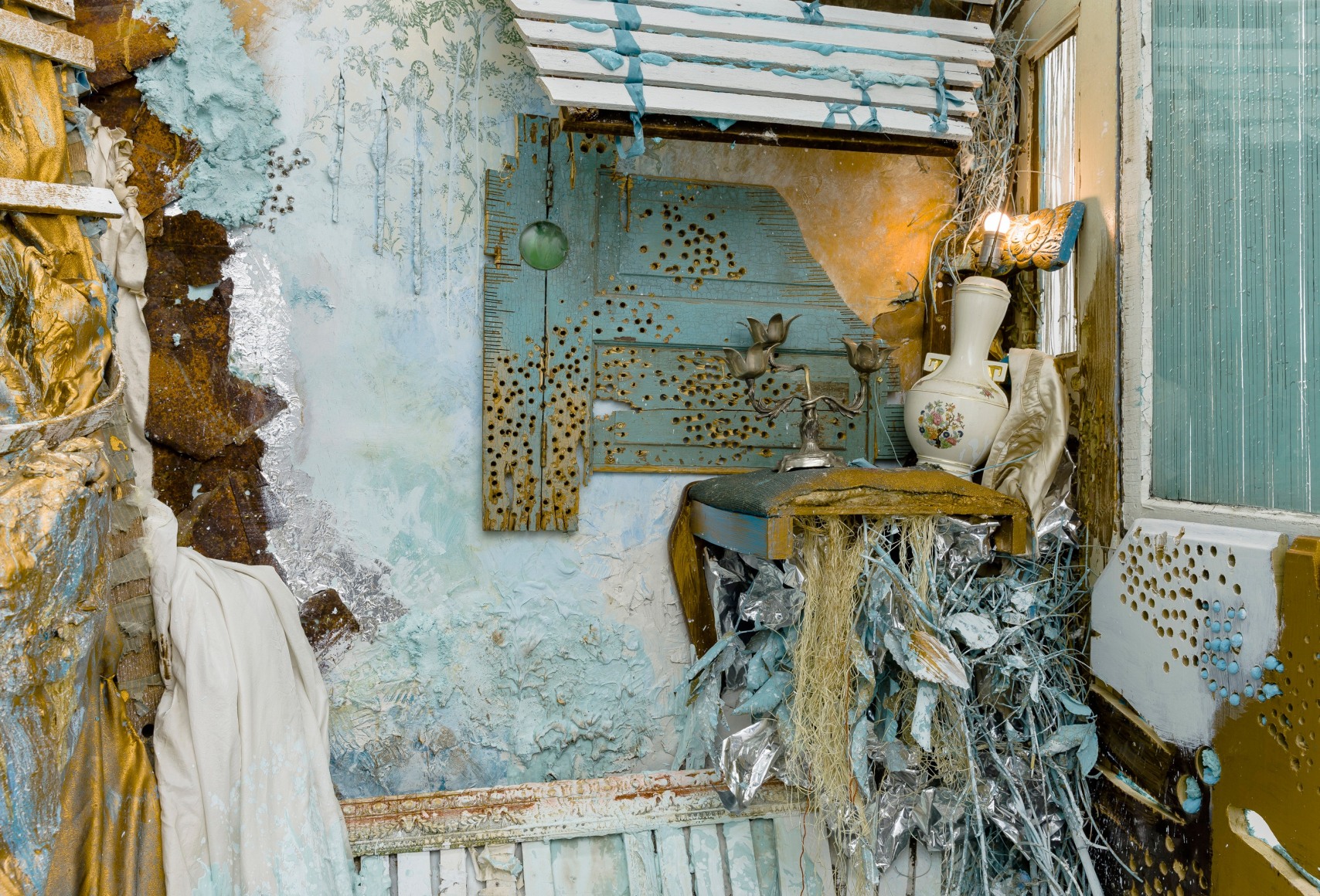 Large installation by Julie Schenkelberg including reclaimed wood and household materials