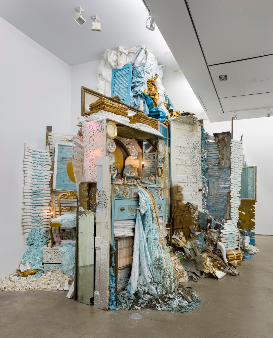 Large installation by Julie Schenkelberg including reclaimed wood and household materials