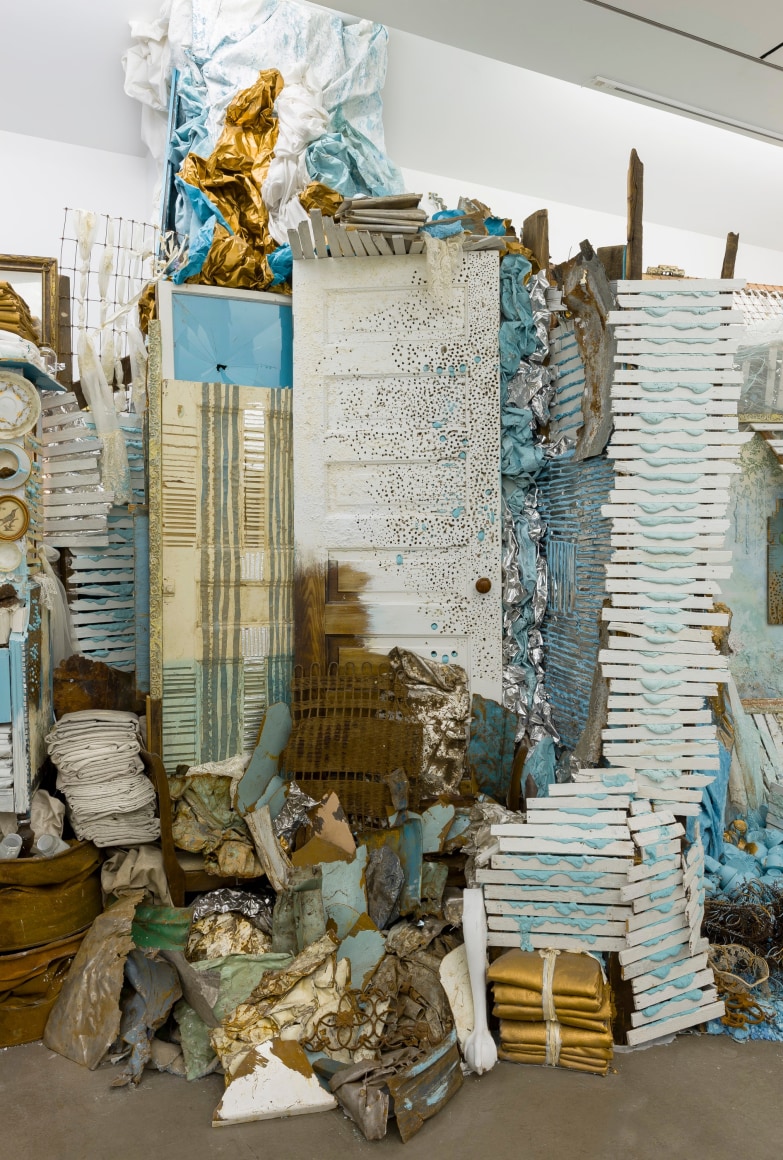 Large installation by Julie Schenkelberg including reclaimed wood and household materials