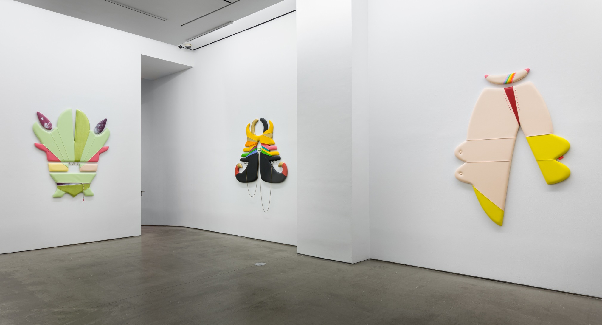 Right wall Installation of vinyl floor and wall sculptures by Trish Tillman