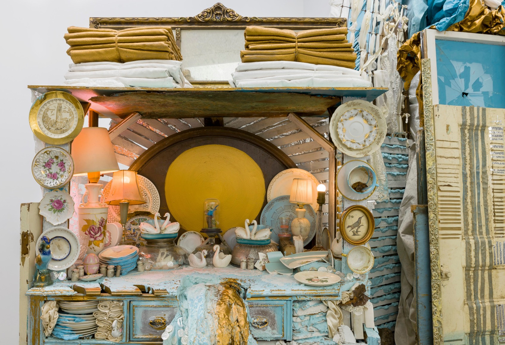 Large installation by Julie Schenkelberg including reclaimed wood and household materials
