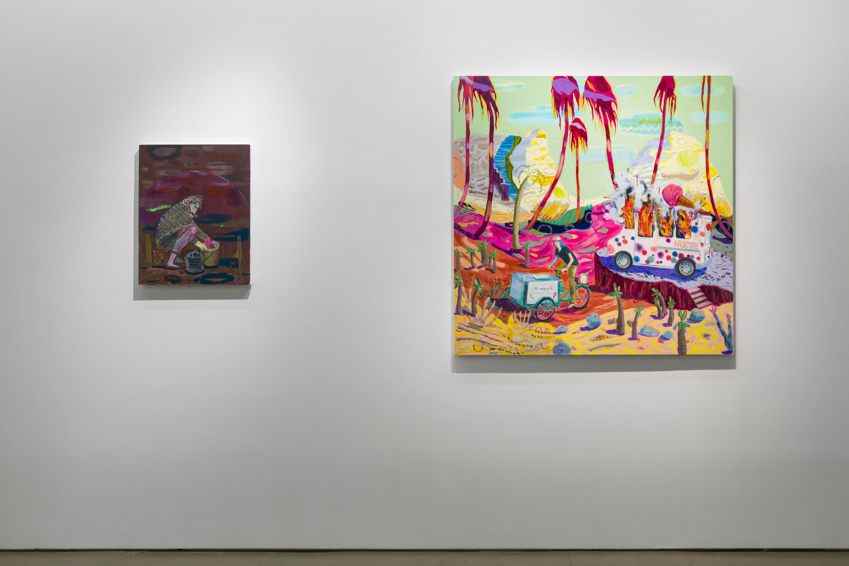 Two of Melanie Daniel's paintings side by side on the wall