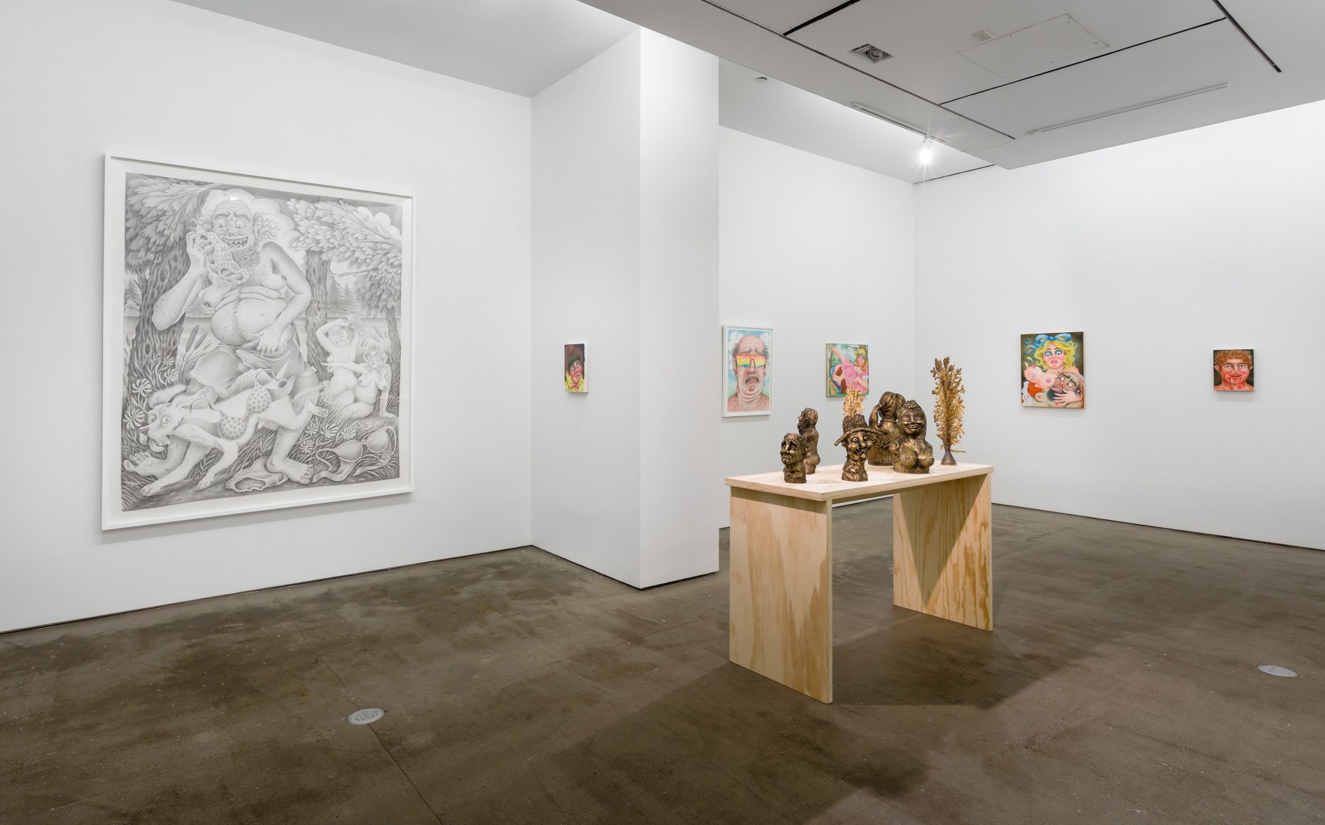 Installation view of "Town and Country" by Rebecca Morgan. Sculptures on a table and paintings and prints on the wall