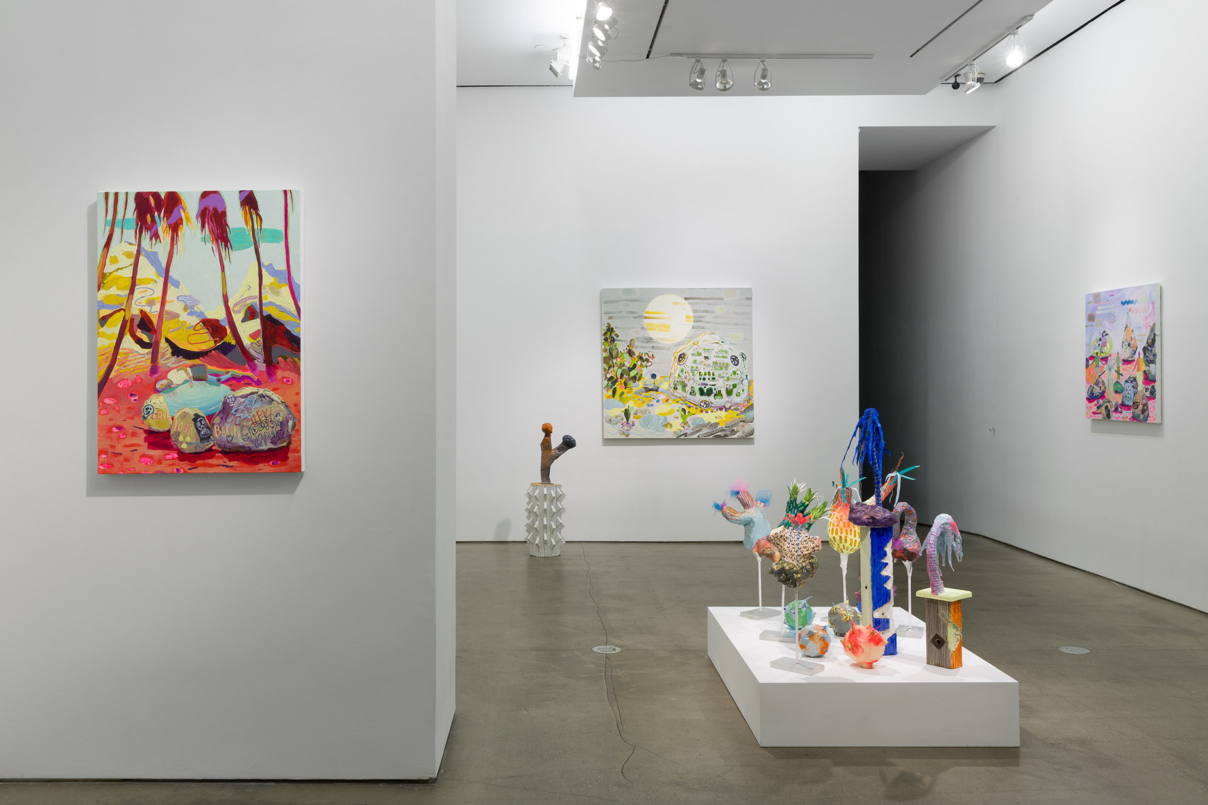 Installation view of Melanie Daniel's solo exhibition, featuring paintings and sculptures