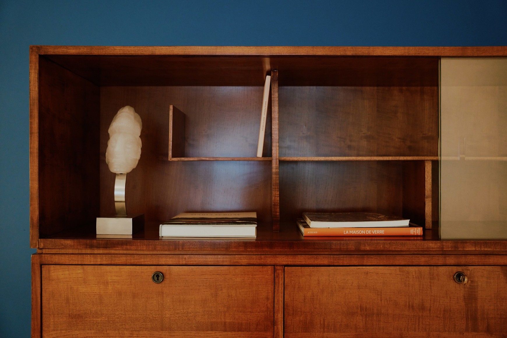 Installation view of works in the gallery, mostly furniture and some rugs and art.