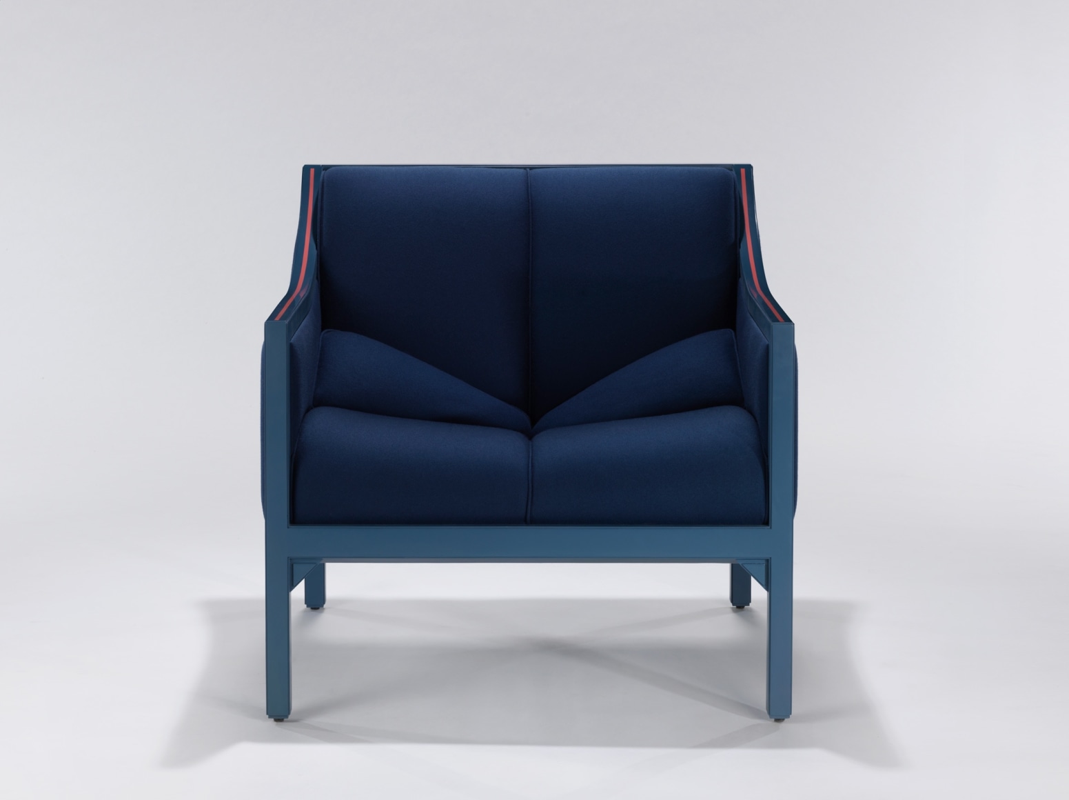 Singular blue upholstered armchair