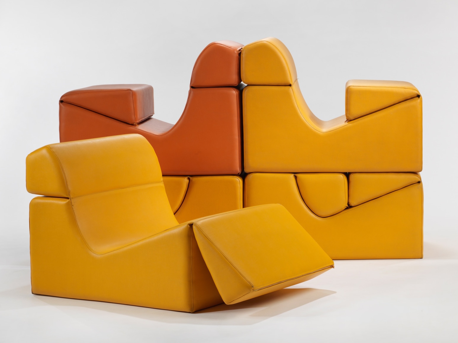 photograph in blank room with chair by Barray, chair is made from foam and vinyl