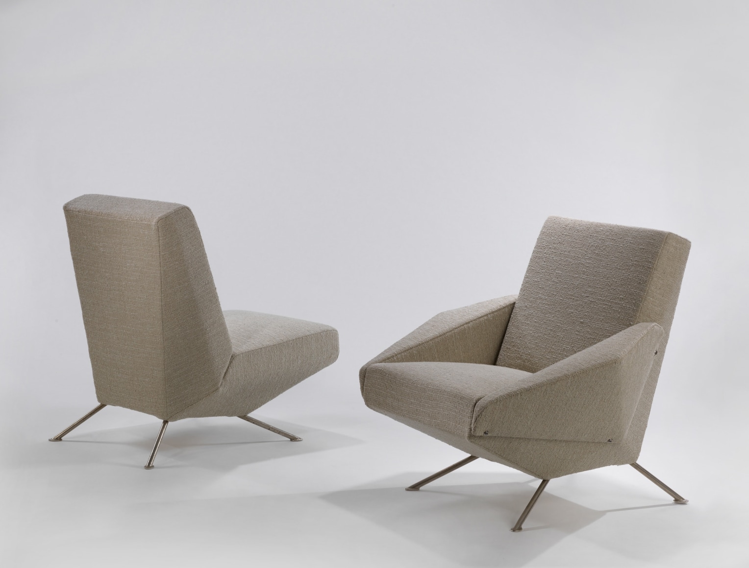 Tubular Steel framed upholstered chairs taken apart from sofa