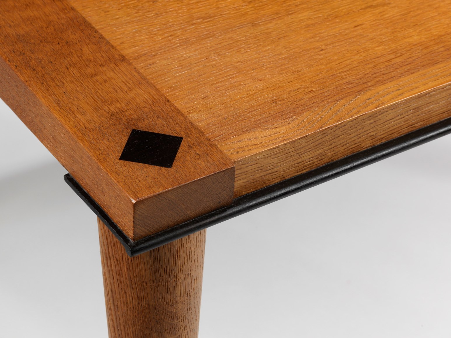 photograph of wood dining table in a blank room