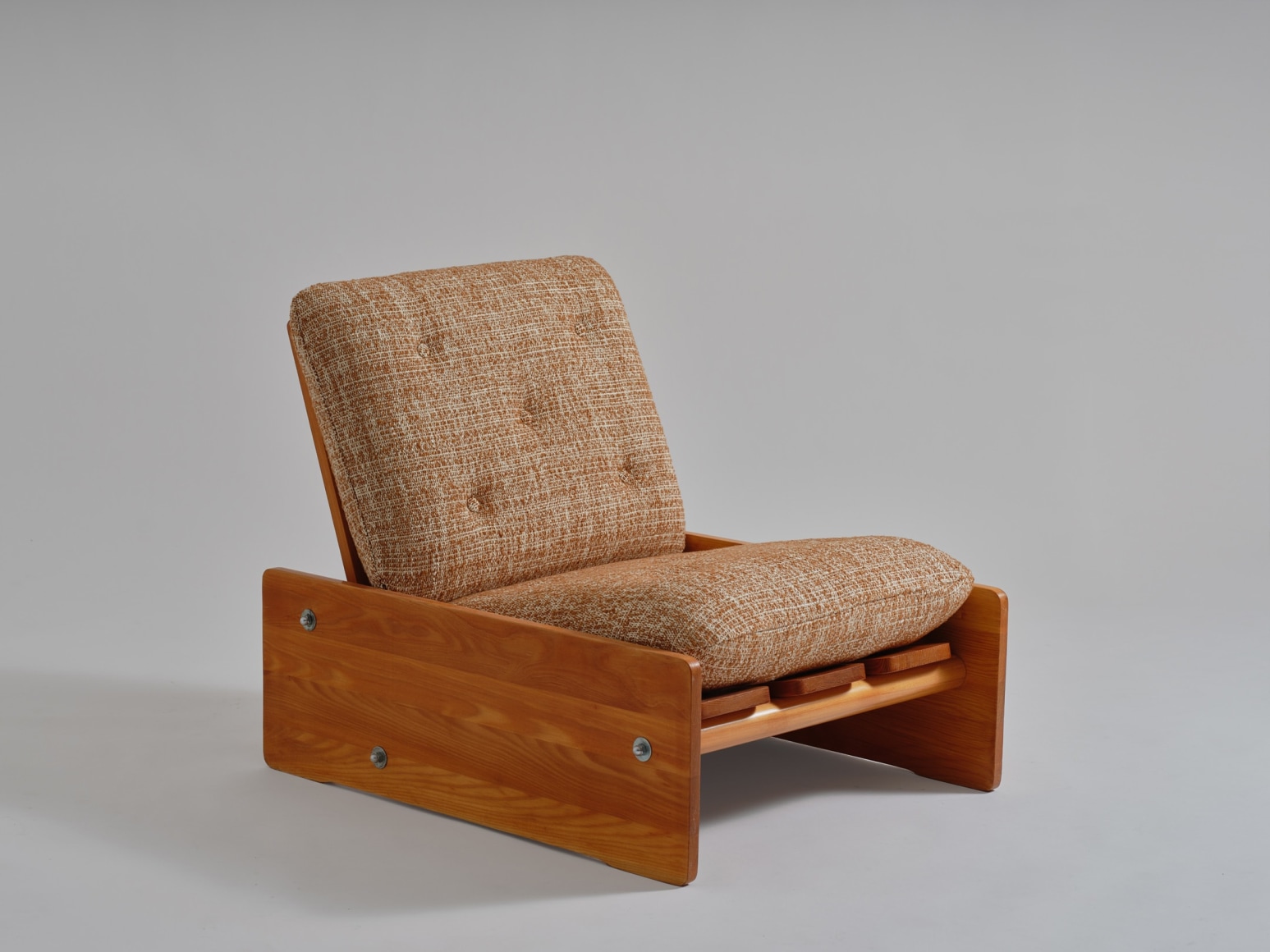 mcm sofa chairs in an empty room