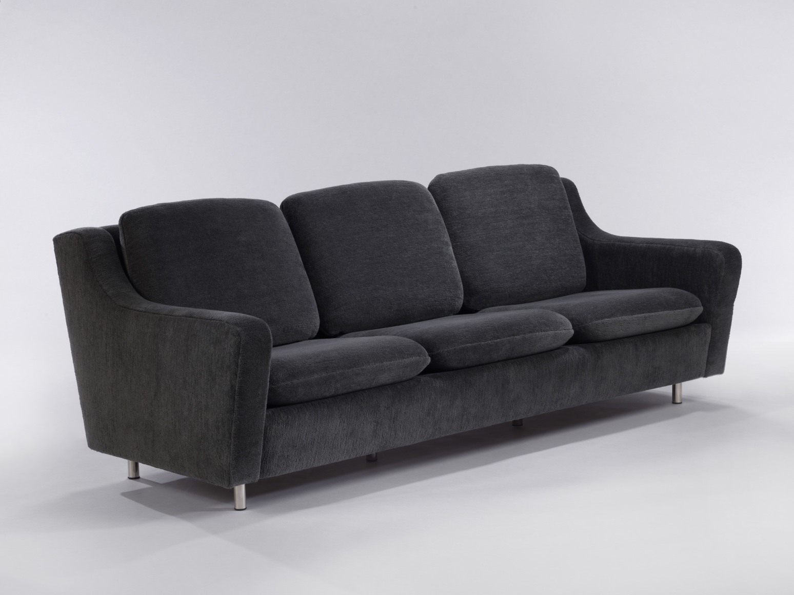 Upholstered three seater sofa with metal legs