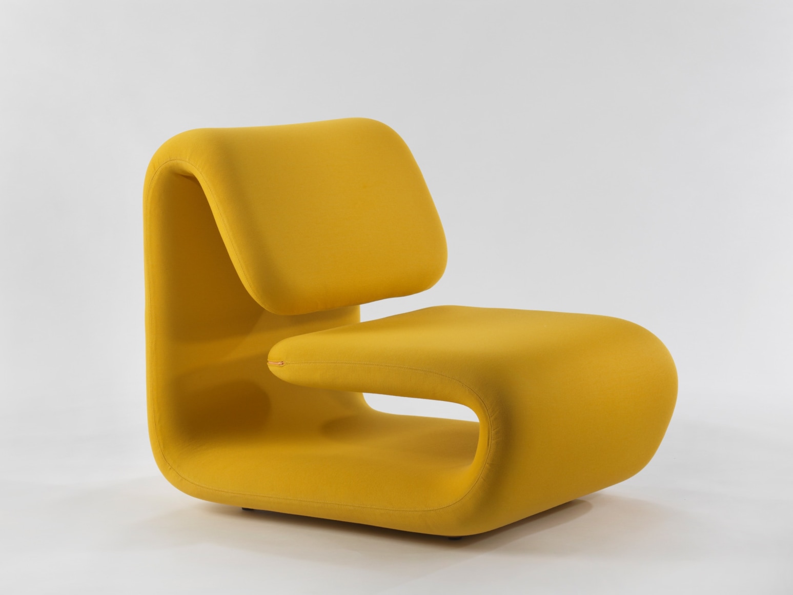 yellow chair in a blank room