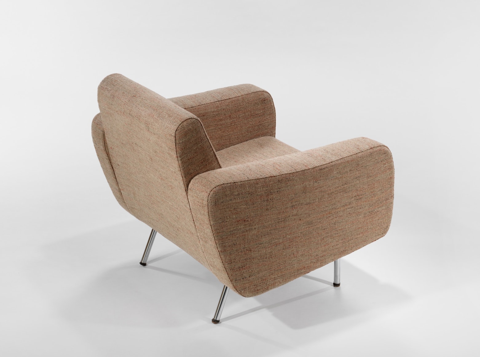 beige chair in a blank room