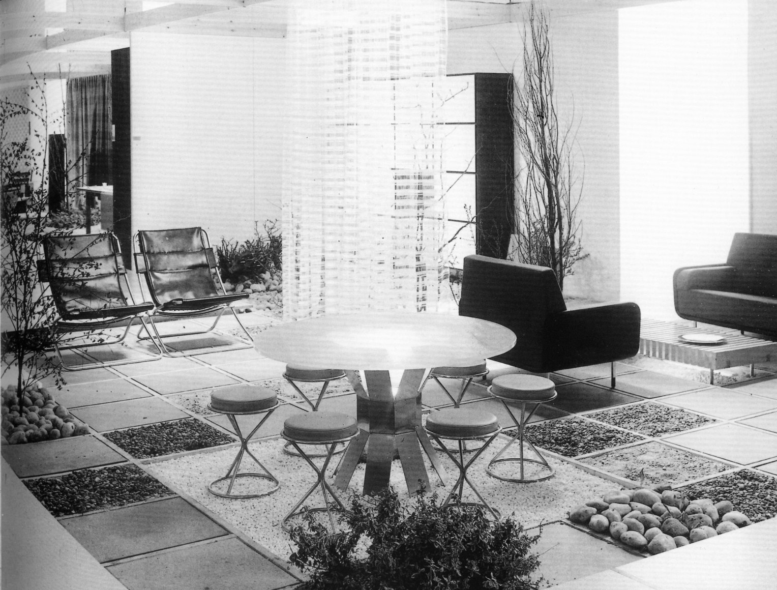 Black and white archival photo of round dining table