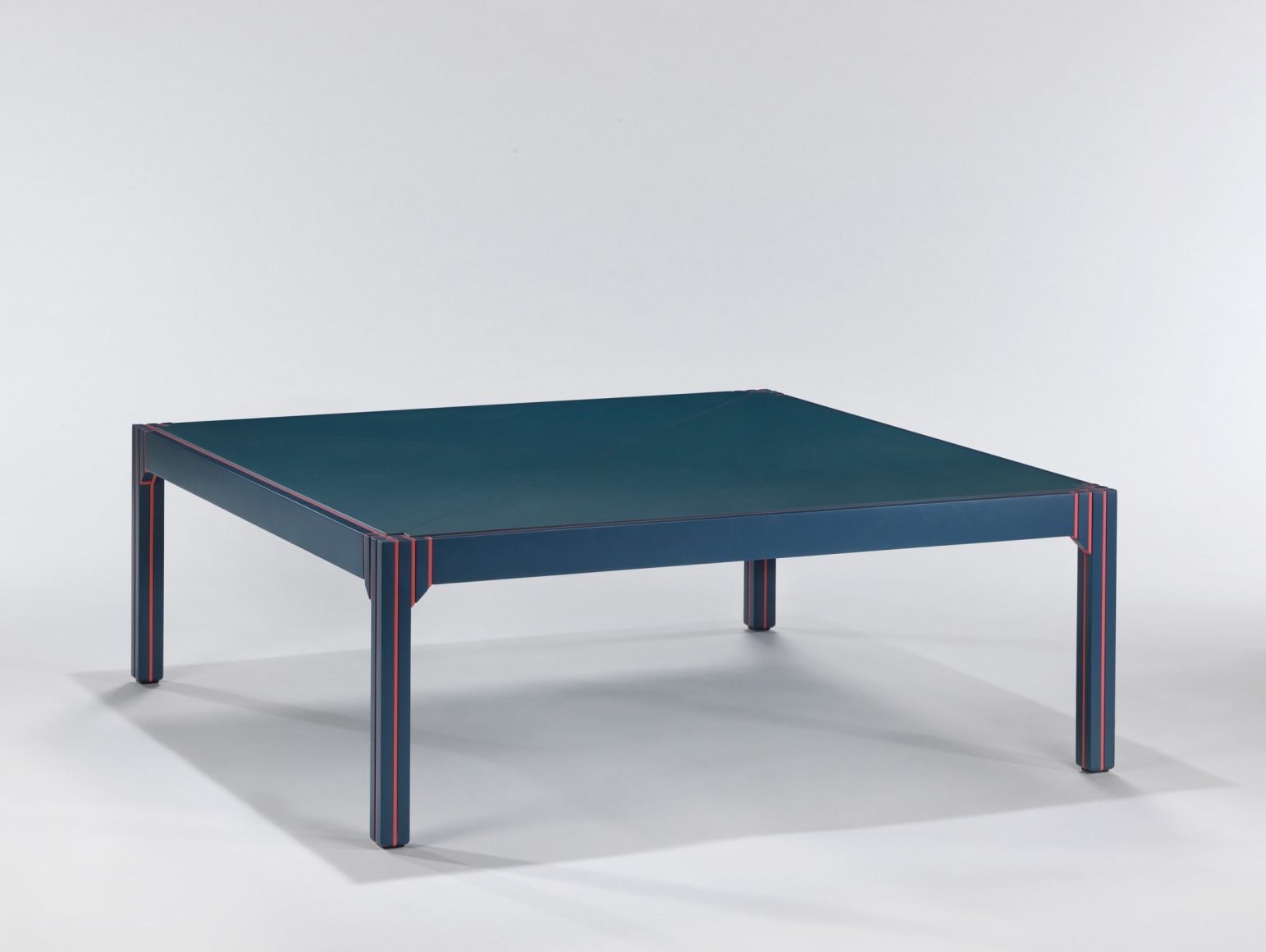 Blue lacquered coffee table with orange detailing by Pierre Paulin