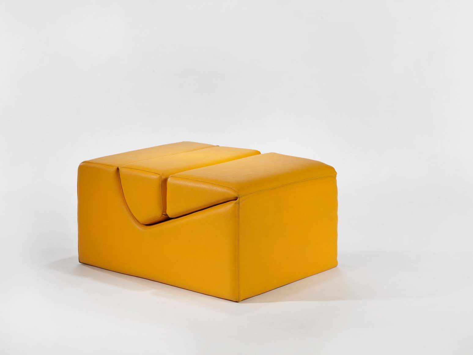 photograph in blank room with chair by Barray, chair is made from foam and vinyl