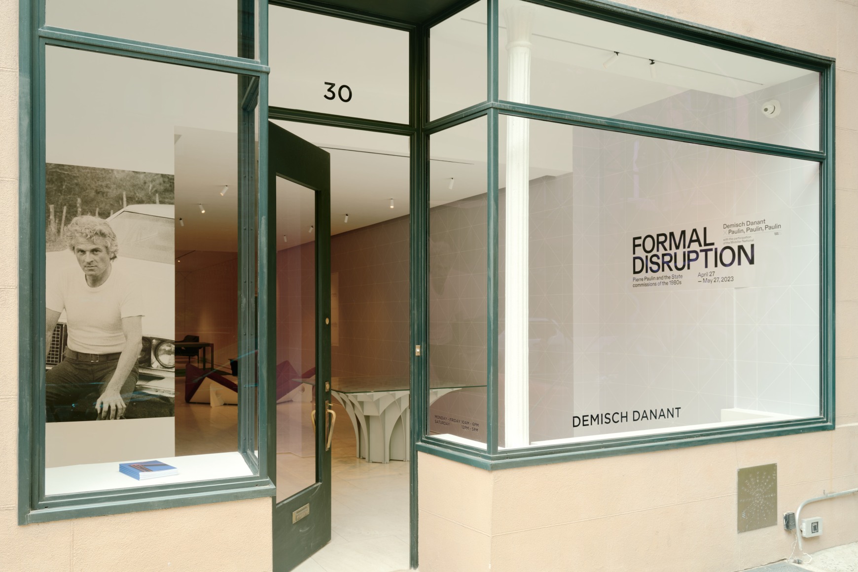 Installation view inside the gallery of works by Pierre Paulin. Multiple in the frame of shot. Many different colors such as blues and reds.