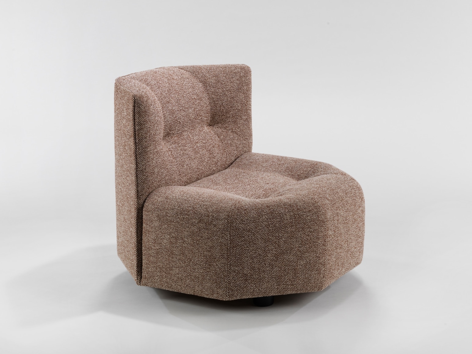 photograph of a chair by Govin in a blank room, chair is brown and has no arms