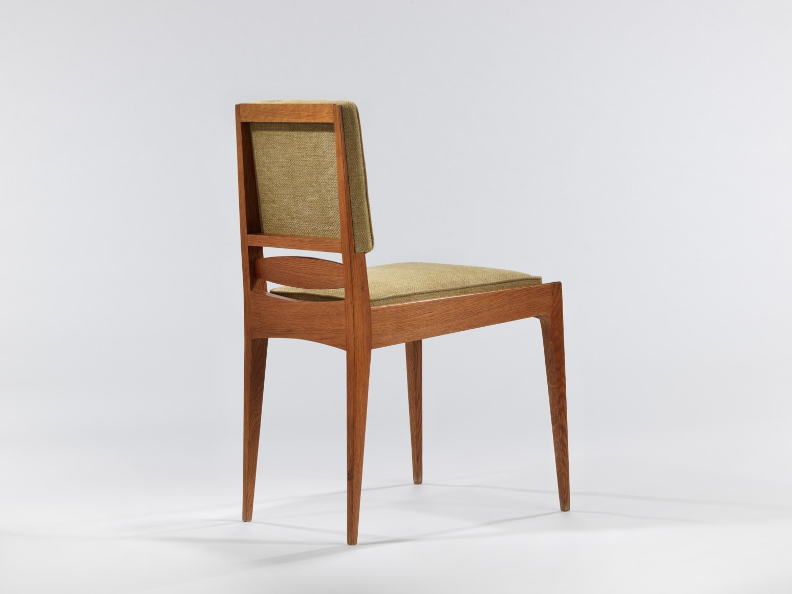 Far away straight on angle of a chair by Maurice Pre.