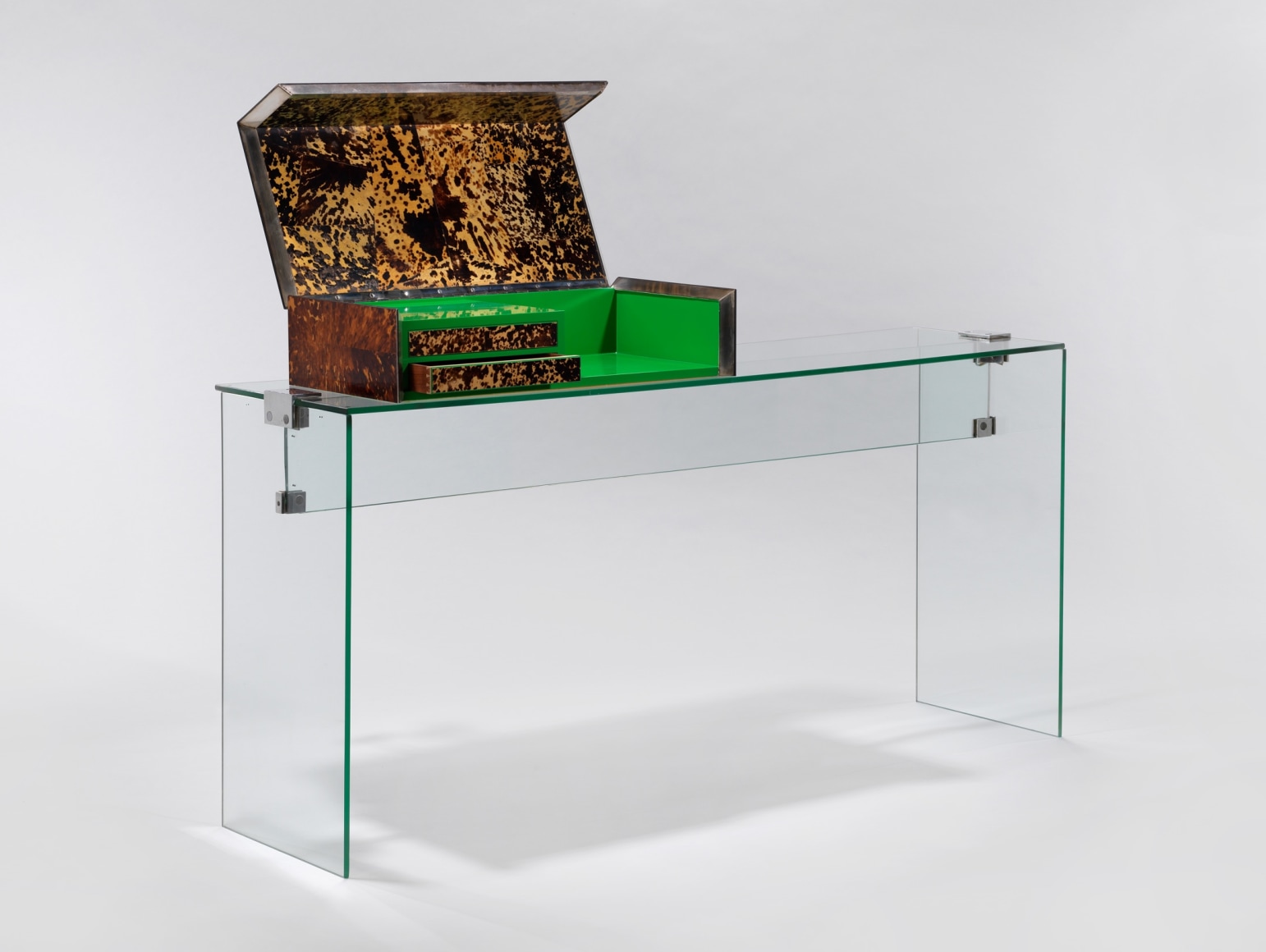 Jacques Dumond console vanity with a box on top. made of glass and has a stool that sits with it. green inside the box. Detail of the piece.