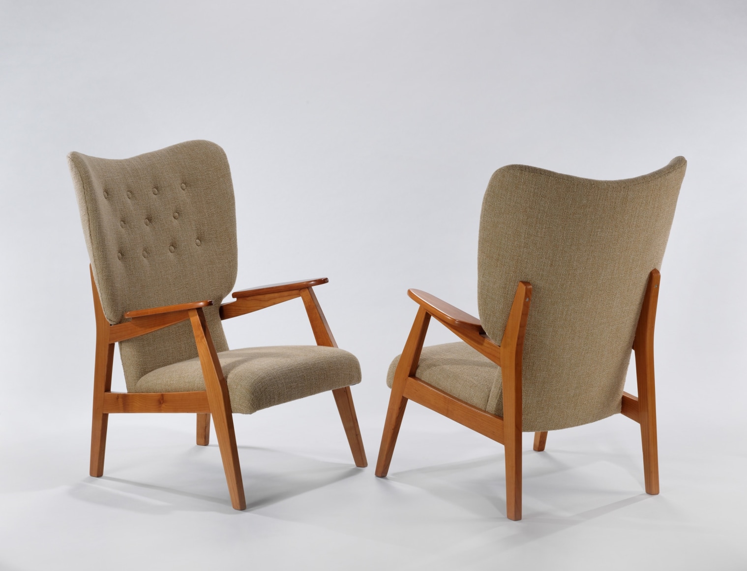 Pair of cream upholstered chair with wood arms by Ren&eacute;-Jean Caillette