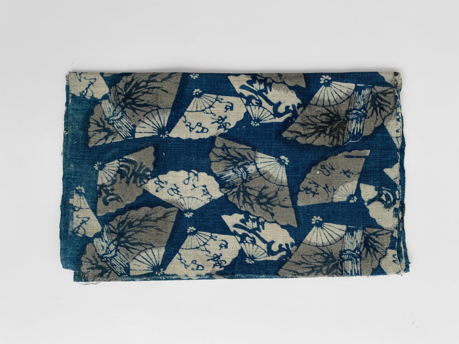 51 Katazome: fan and poems, late nineteenth century, indigo dyed cotton and charcoal based dye