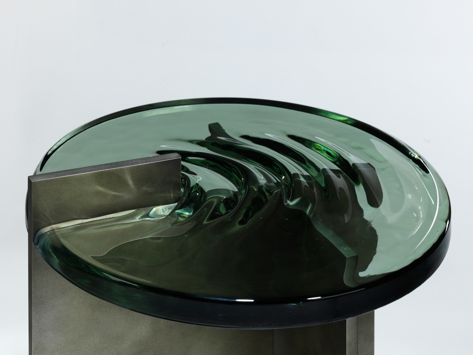 Madonna side table in aluminum and glass against a plain white background.