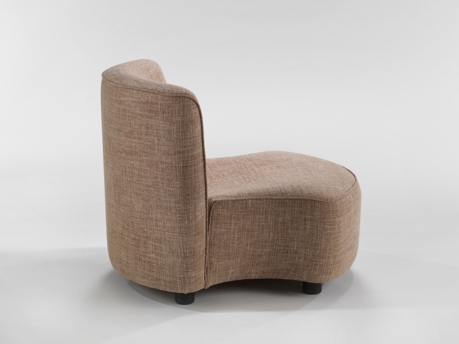 photograph of chair by Govin, chair is beige and sits low to the floor