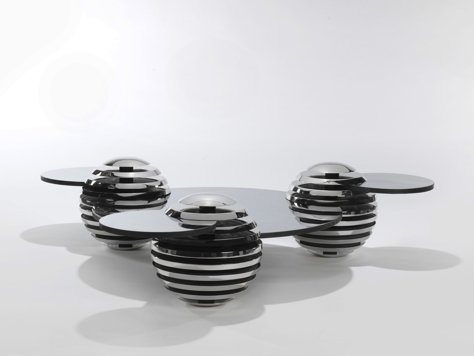 Steel and metal table by Mansau in a blank room
