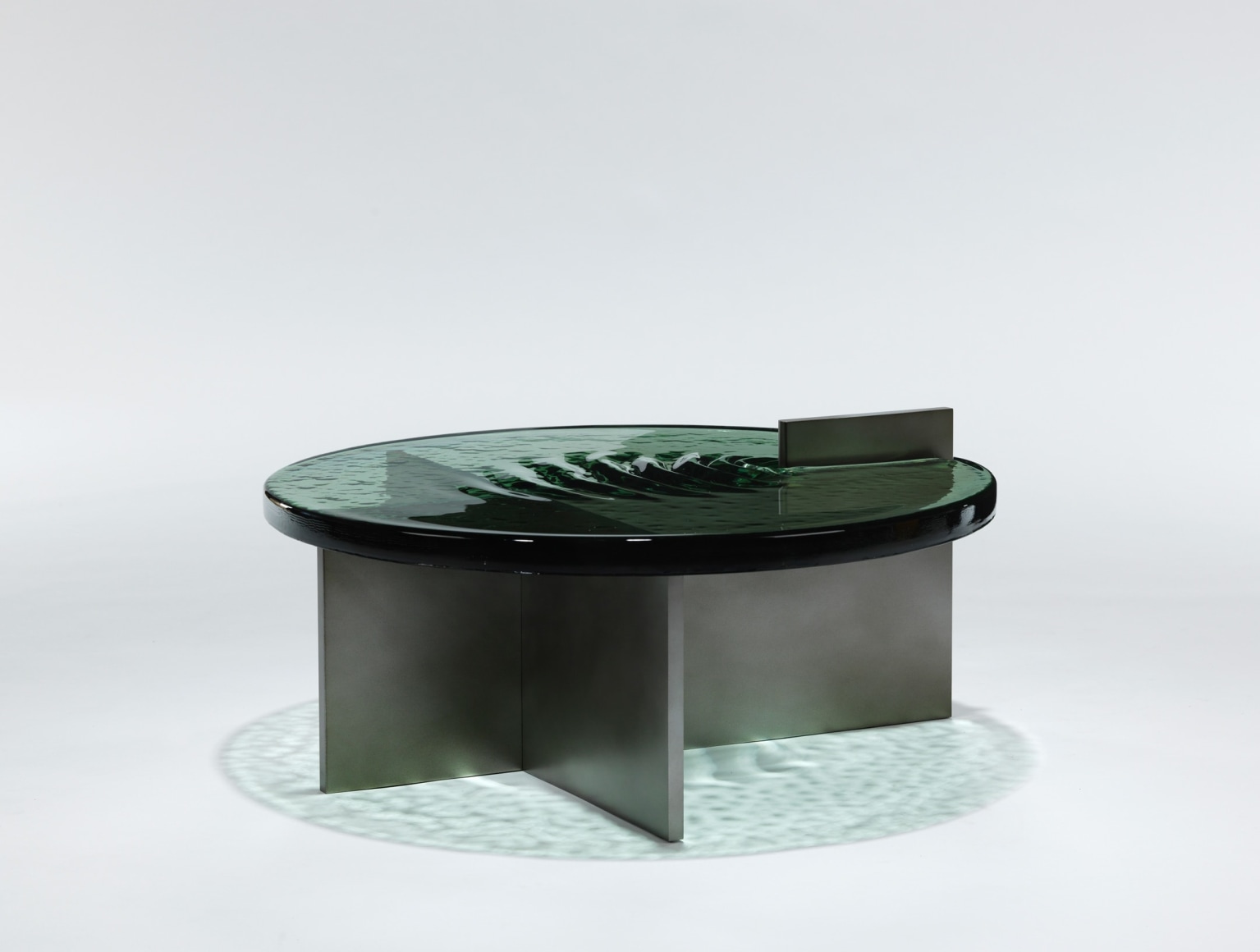 glass and aluminum tables that looks like water