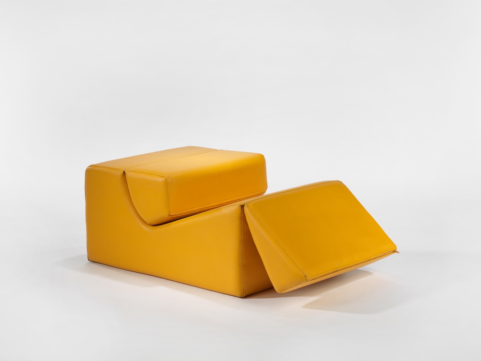 photograph in blank room with chair by Barray, chair is made from foam and vinyl