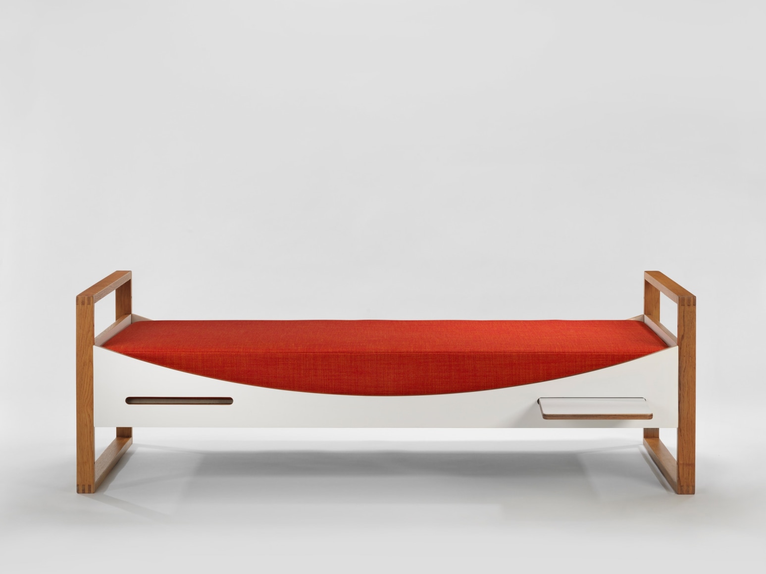 midcentury bed in an empty room