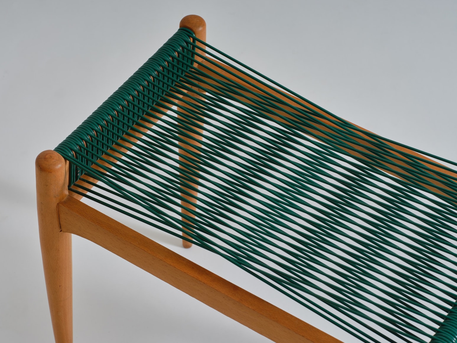 mcm stool in an empty room