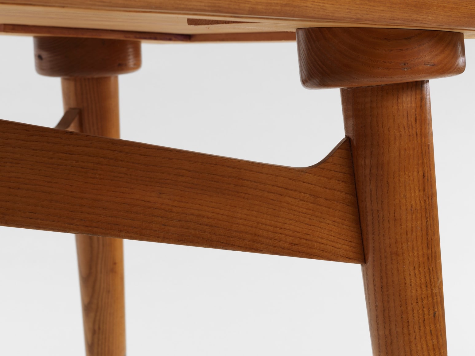 photograph of a wood desk in a blank room