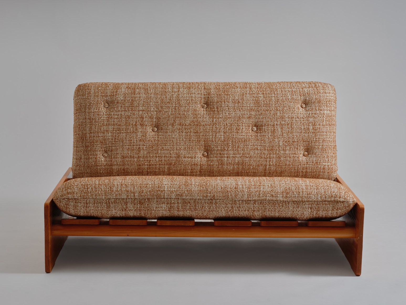 mcm sofa in an empty room