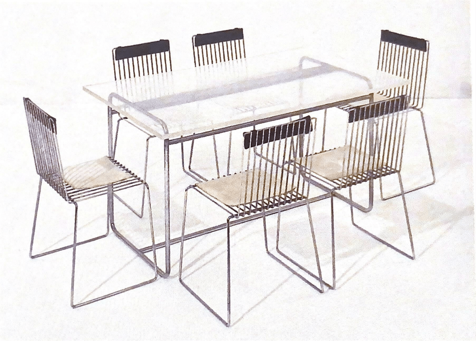 Table Antoine Dubois for the apartment of Micheline Presle. Presented with the stackable wire series chair. Collection Fran&ccedil;ois Arnal.