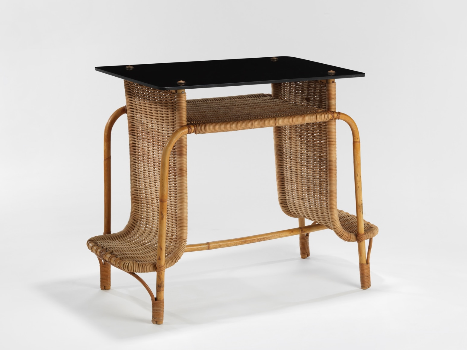 rattan desk in an empty room