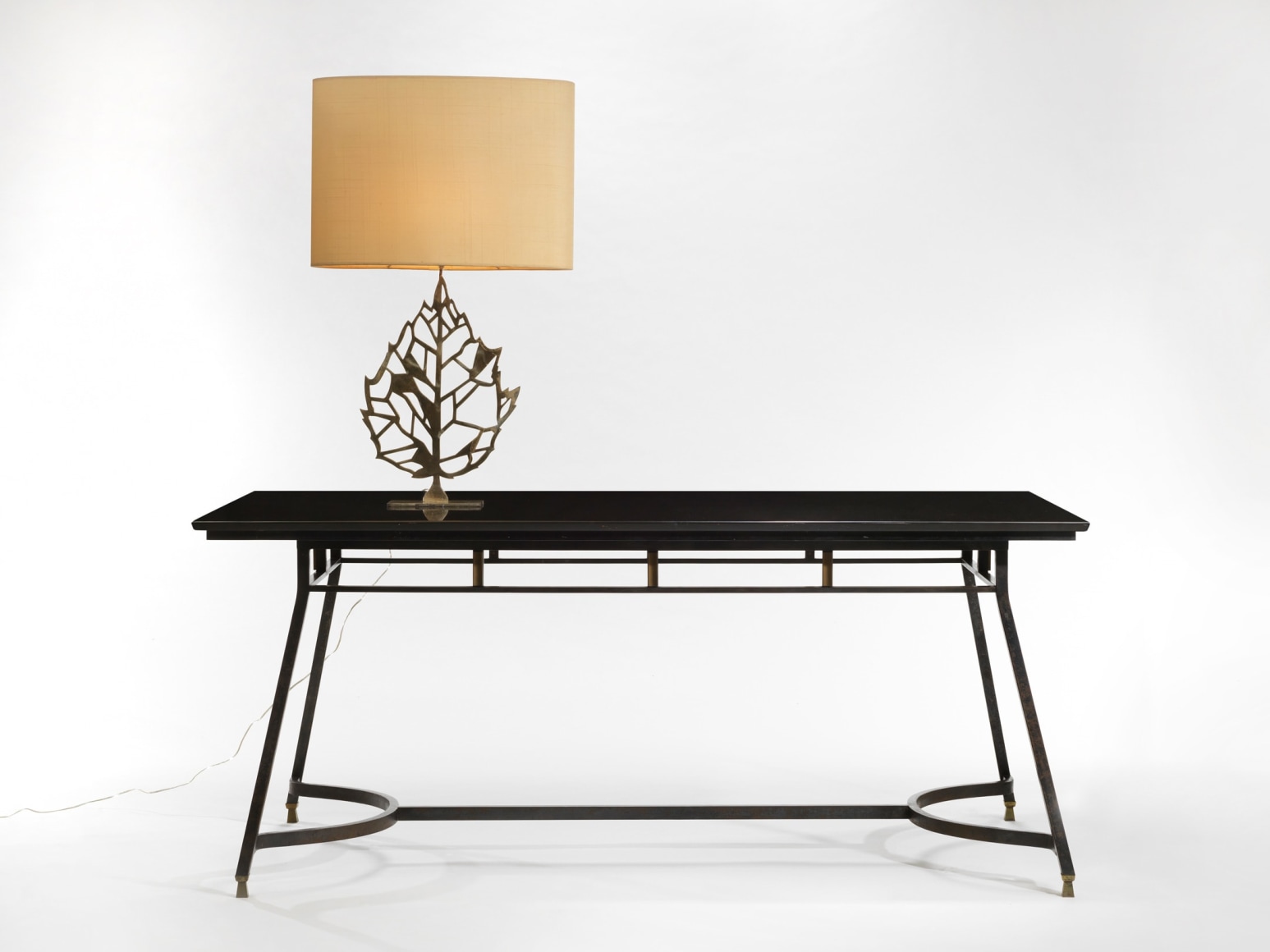 photograph of a black table in a blank room