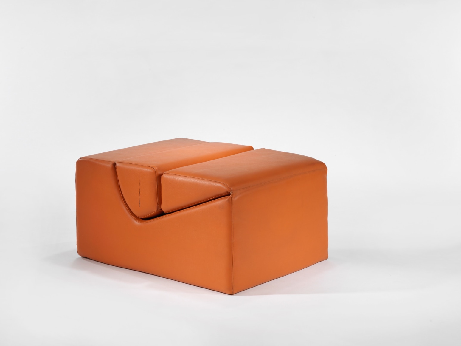 photograph in blank room with chair by Barray, chair is made from foam and vinyl