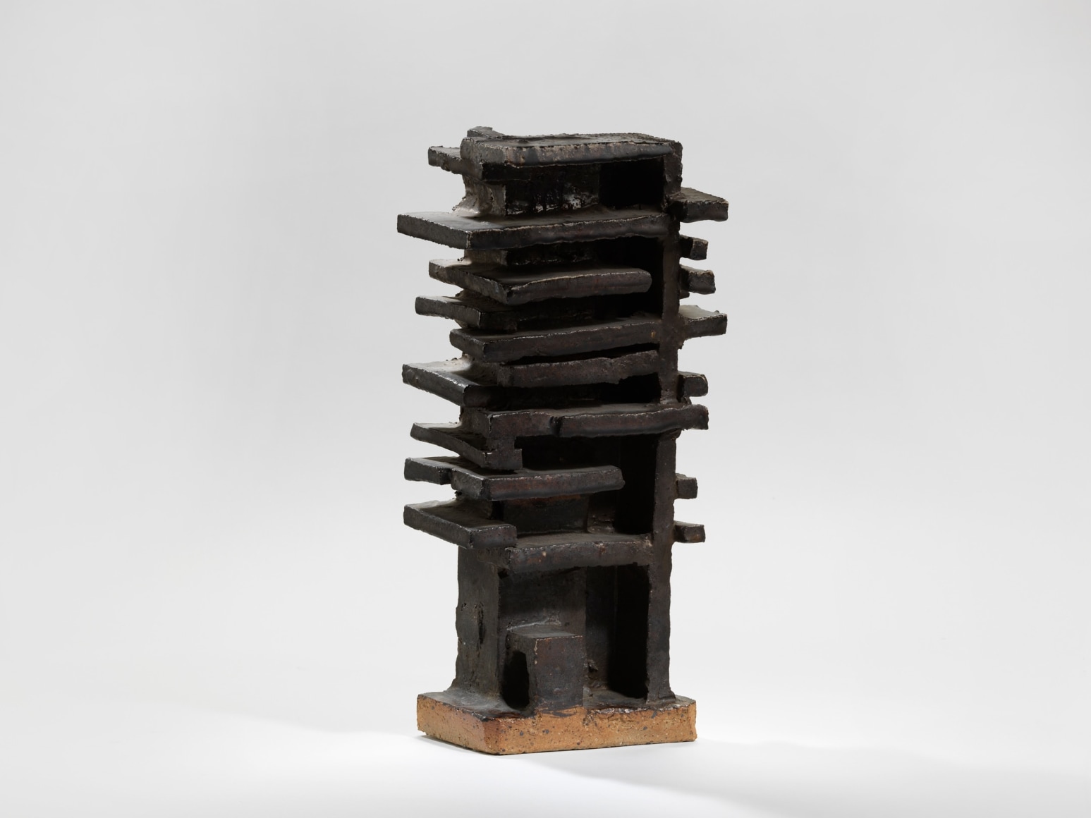 photograph of a geometric sculpture in an empty room