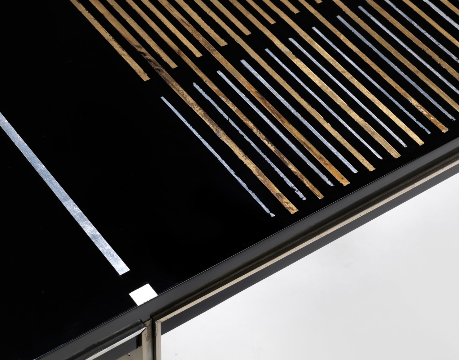 photograph of a black table in a blank room