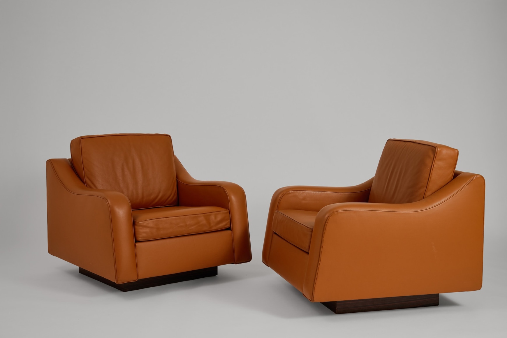 Motte pair of chairs in an empty room