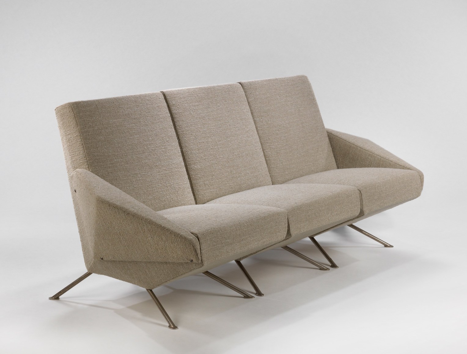 Tubular Steel frame with cream upholstered seats that can be broken into individual chairs with detachable arms