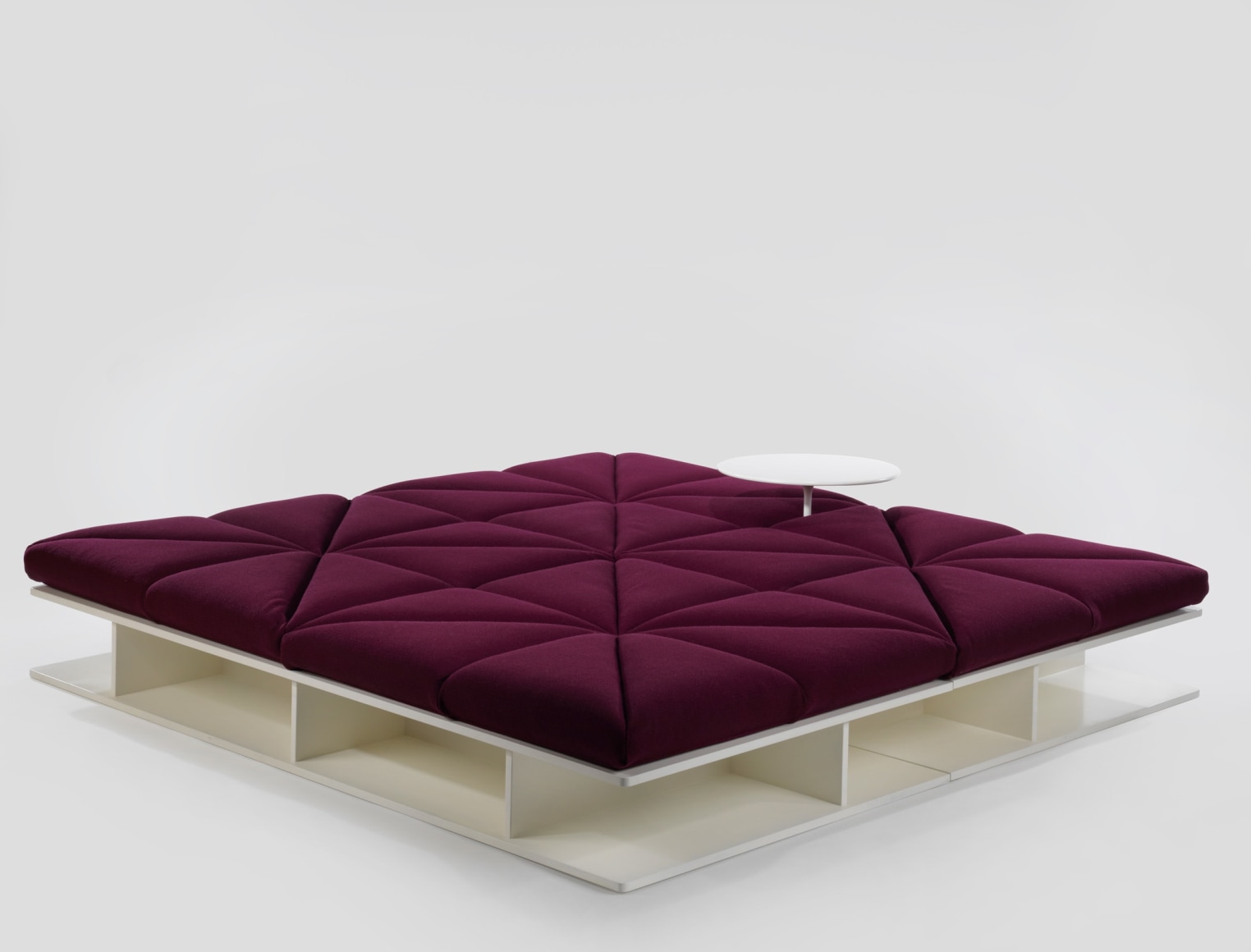 Upholstered modular sofa with removable base and table in flat position by Pierre Paulin