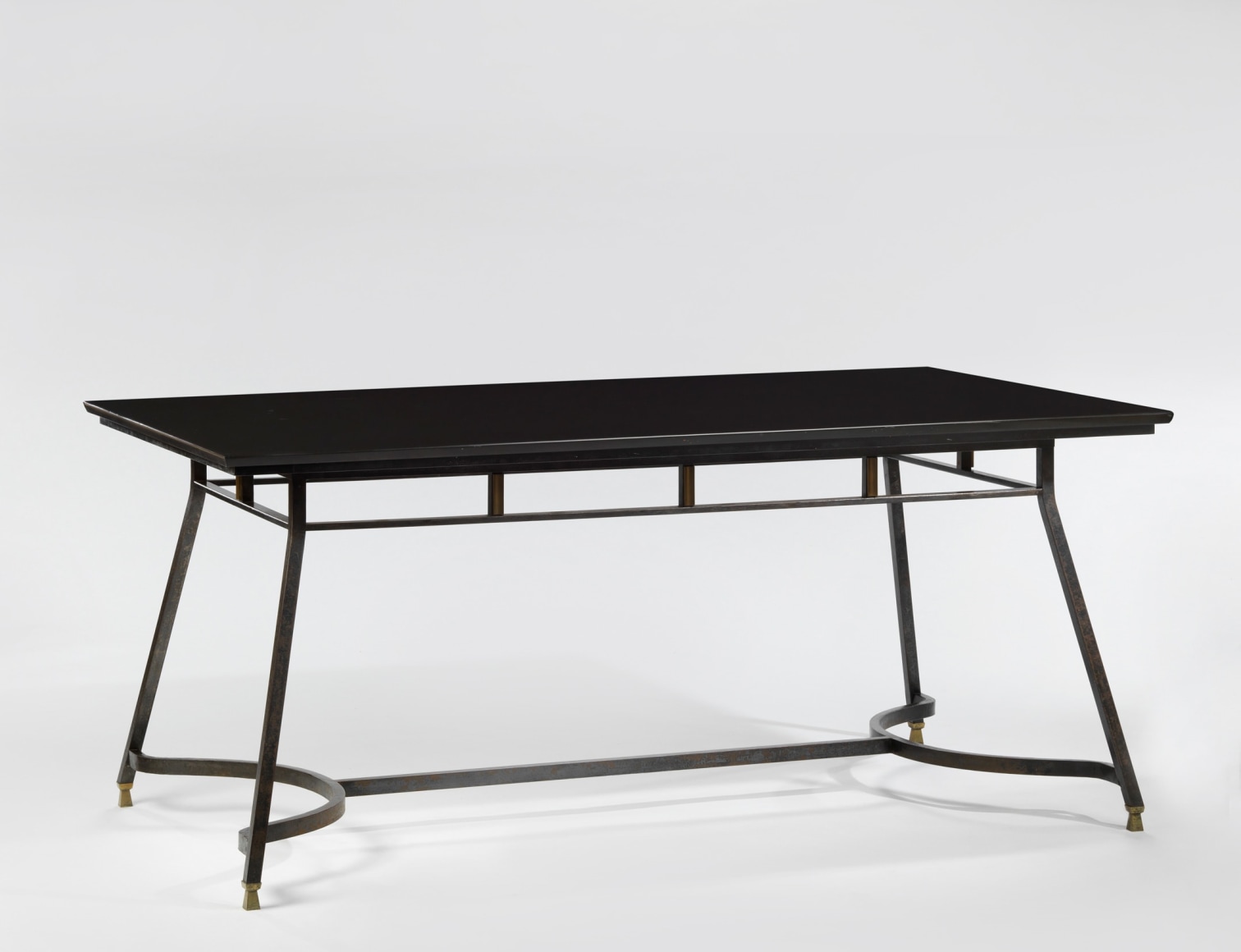 photograph of a black table in a blank room