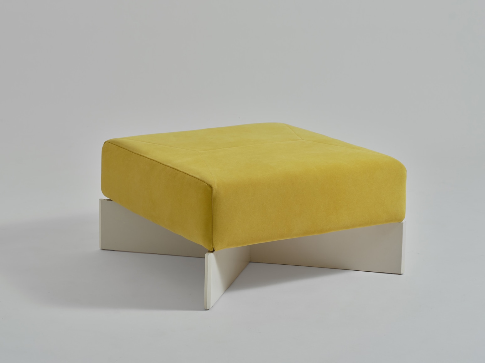 yellow stool in an empty room