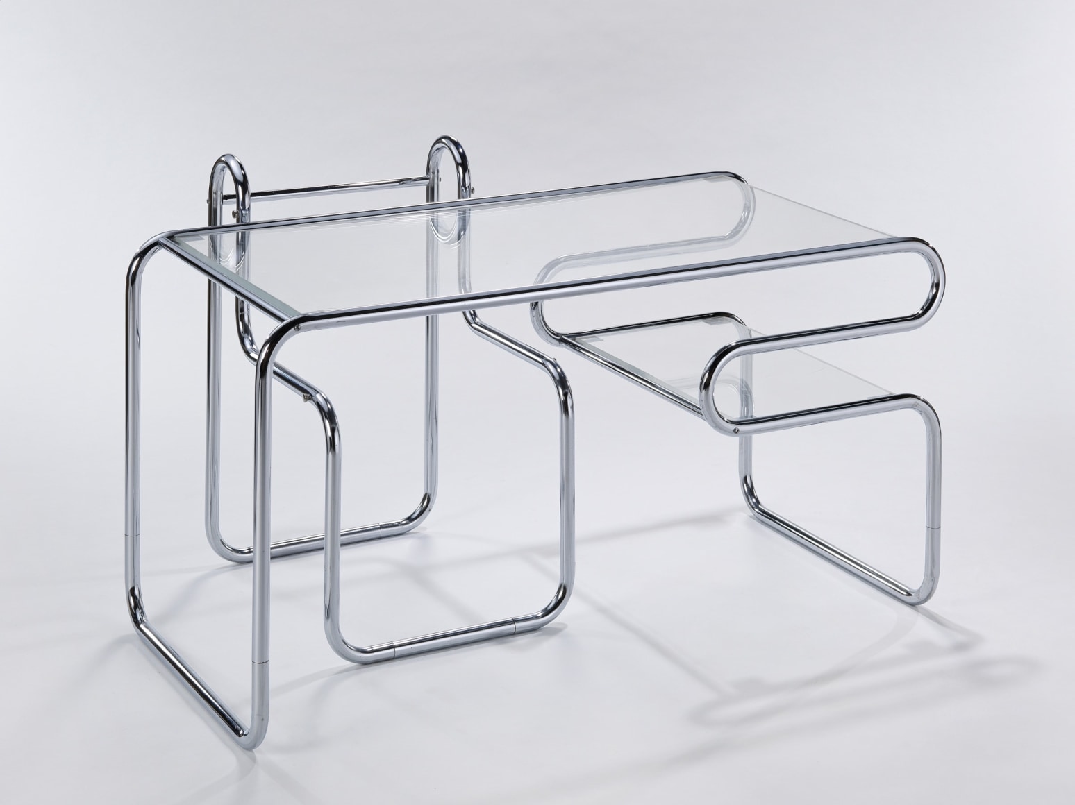 Chrome tubular glass topped desk with matching chair by Michel Hamon